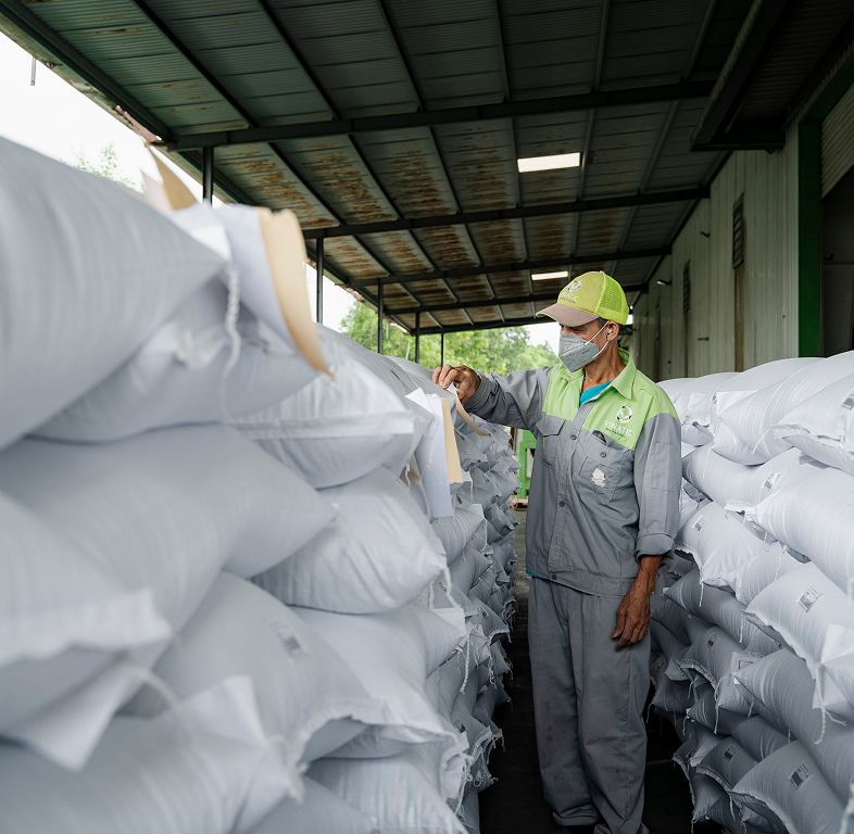 Warehouse worker inspecting sacks